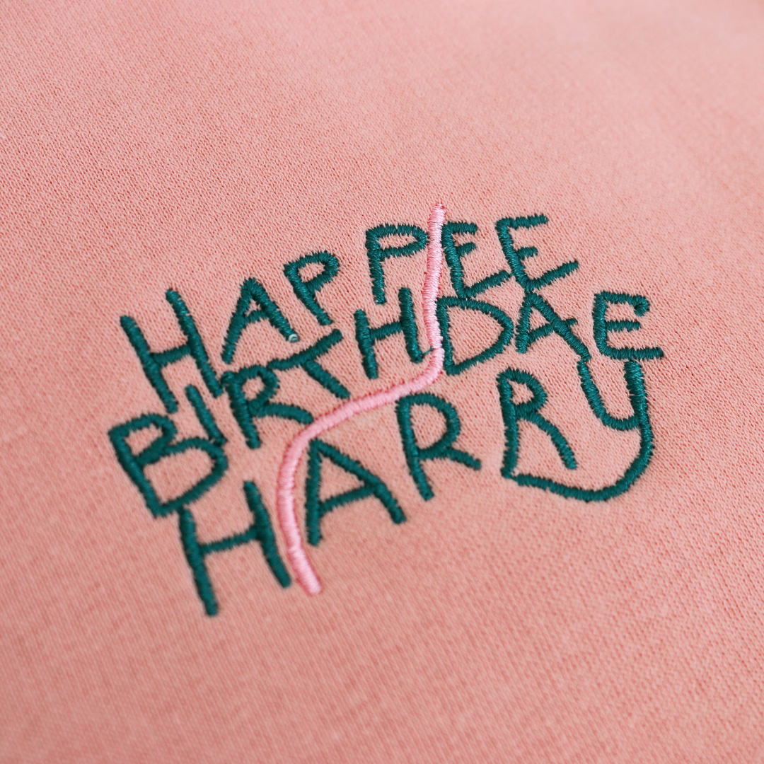 pink hoodie with Happee Birthdae Harry design, inspired by the Harry Potter series